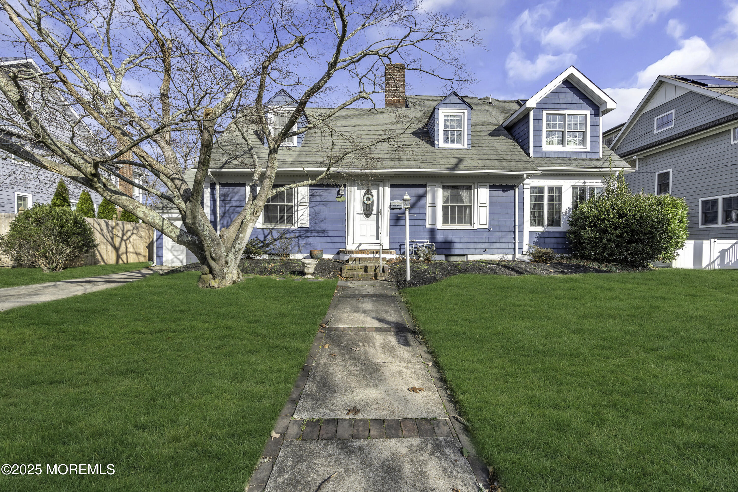 326 South Boulevard Spring Lake, NJ 07762 - Photo 5 of 54 a front view of a house with a yard