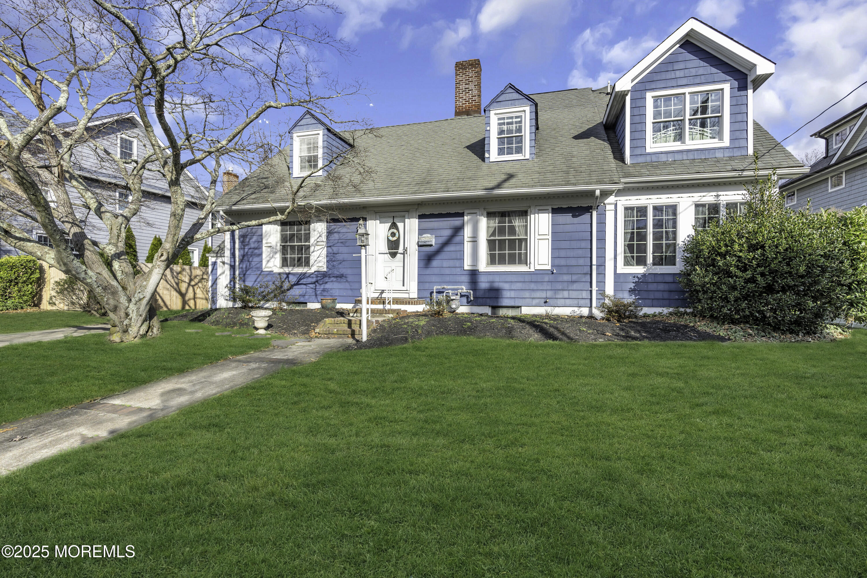 326 South Boulevard Spring Lake, NJ 07762 - Photo 6 of 54 a front view of a building with a garden
