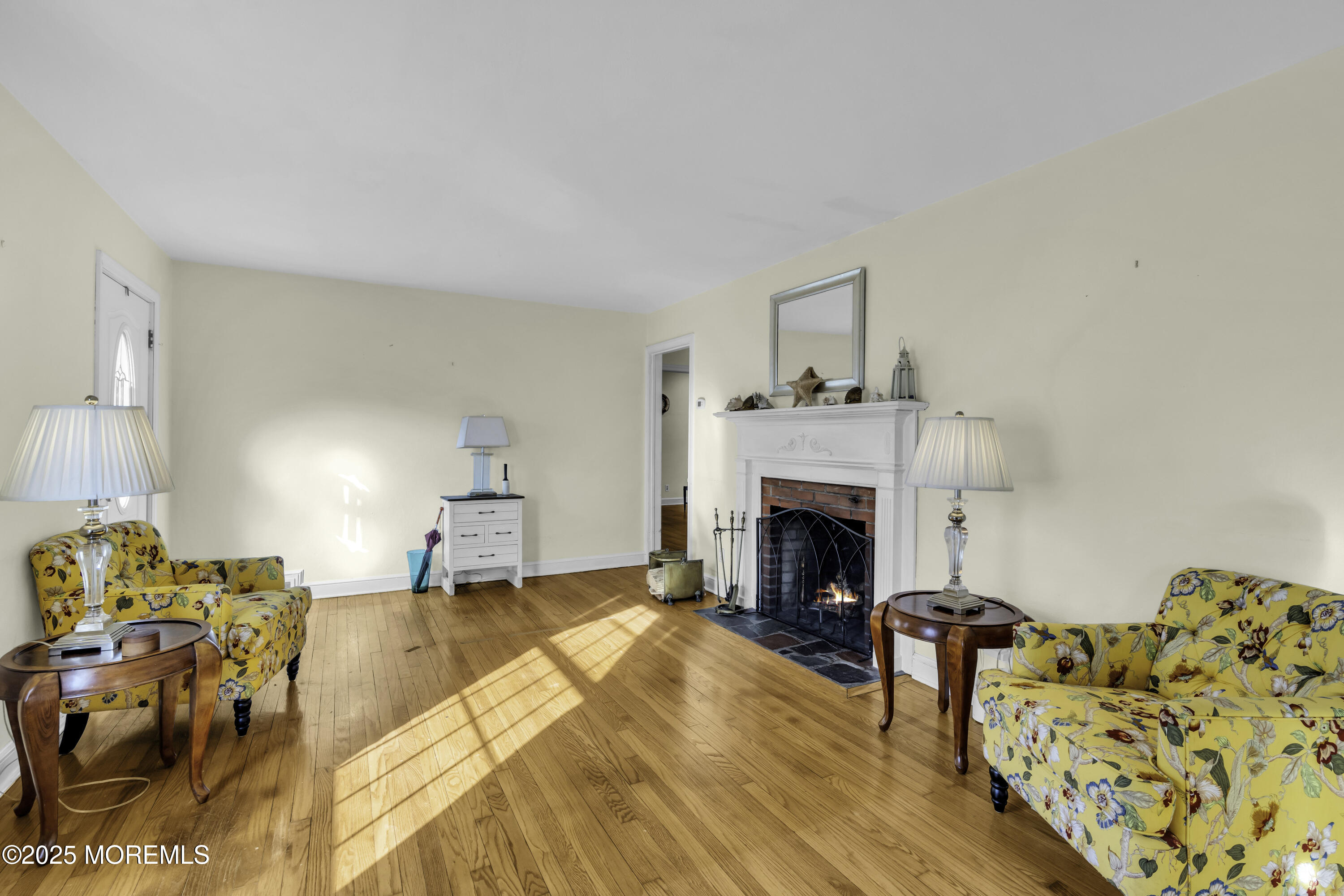 326 South Boulevard Spring Lake, NJ 07762 - Photo 9 of 54 a view of a livingroom with furniture a fireplace and wooden floor