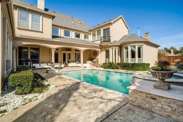 a front view of a house with swimming pool