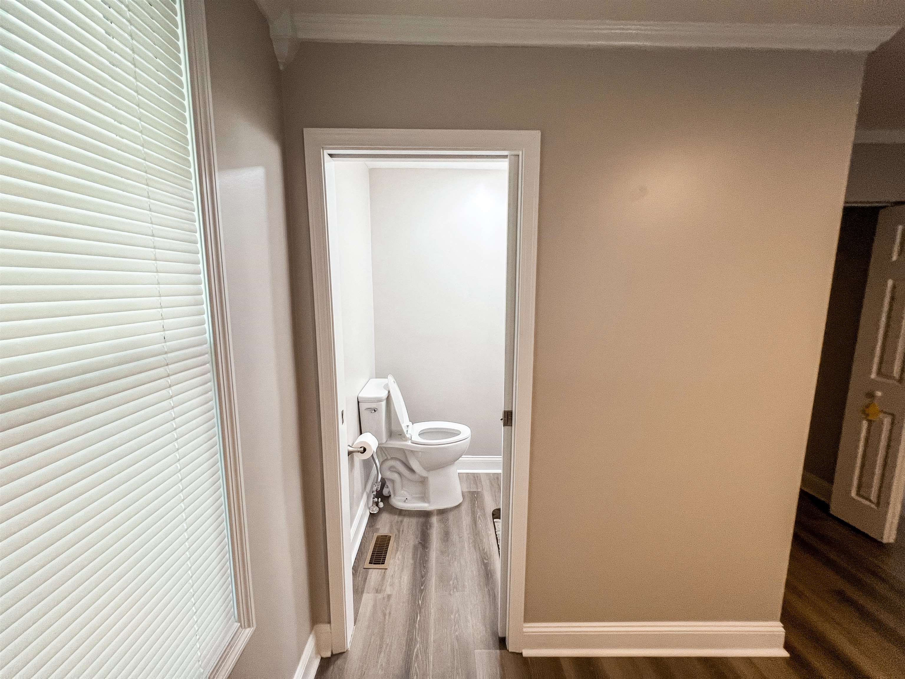 202 Morris Street Waynesboro, TN 38485 - Photo 30 of 36 Bathroom featuring wood finished floors and ornamental molding
