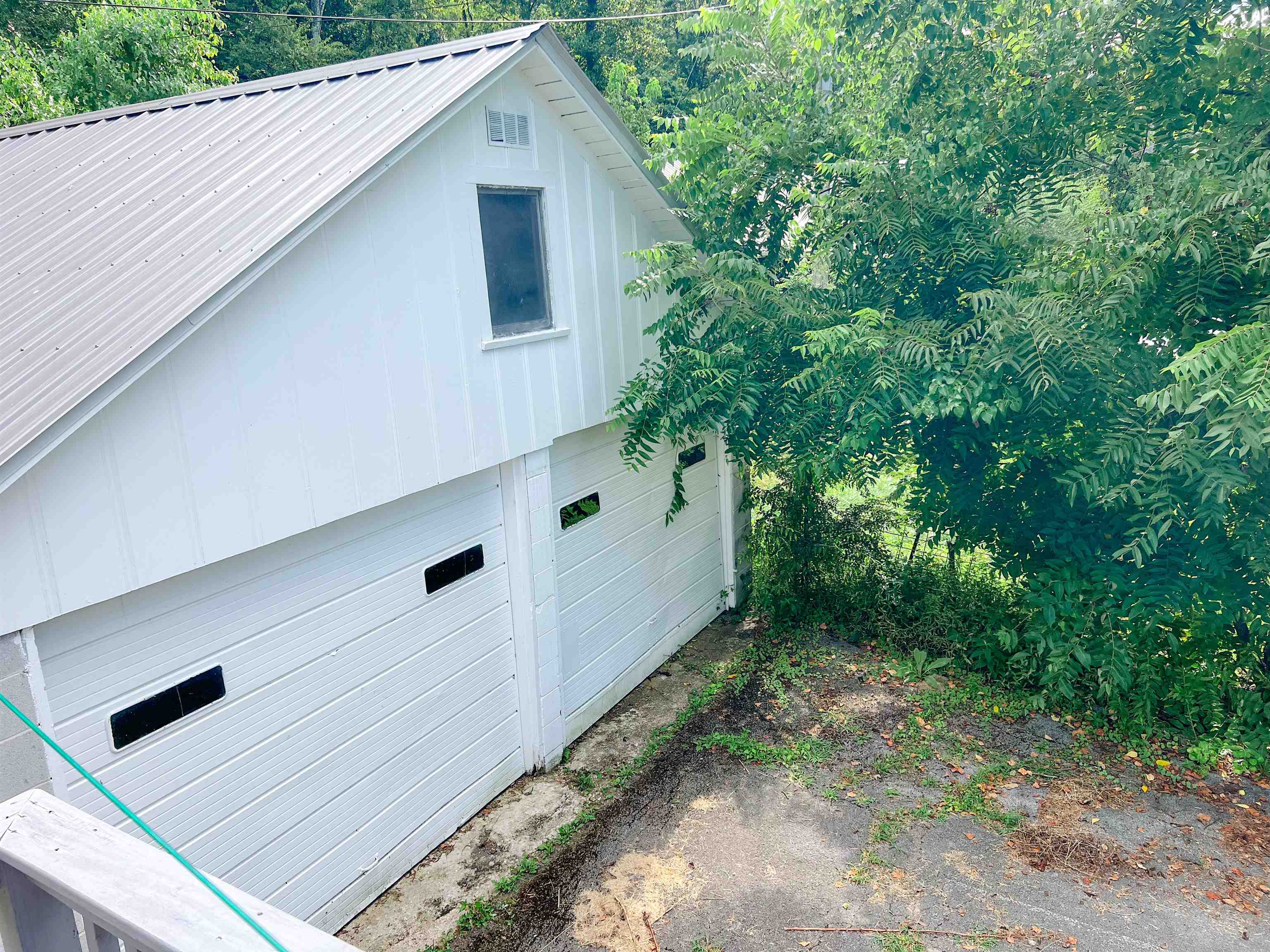 202 Morris Street Waynesboro, TN 38485 - Photo 35 of 36 View of home's exterior featuring a metal roof