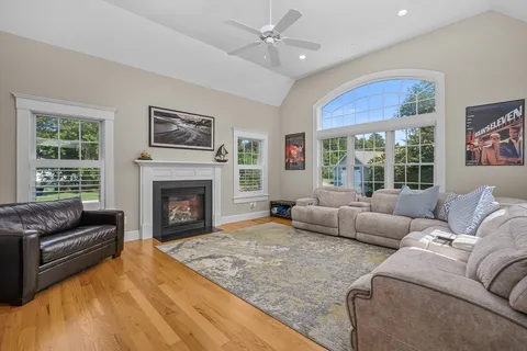 a living room with furniture window and a fireplace