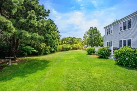 a view of a backyard with sitting area