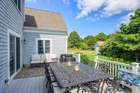a view of a deck with furniture