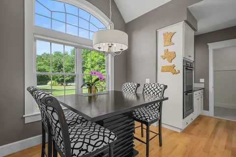 a view of a dining room with furniture window and outside view