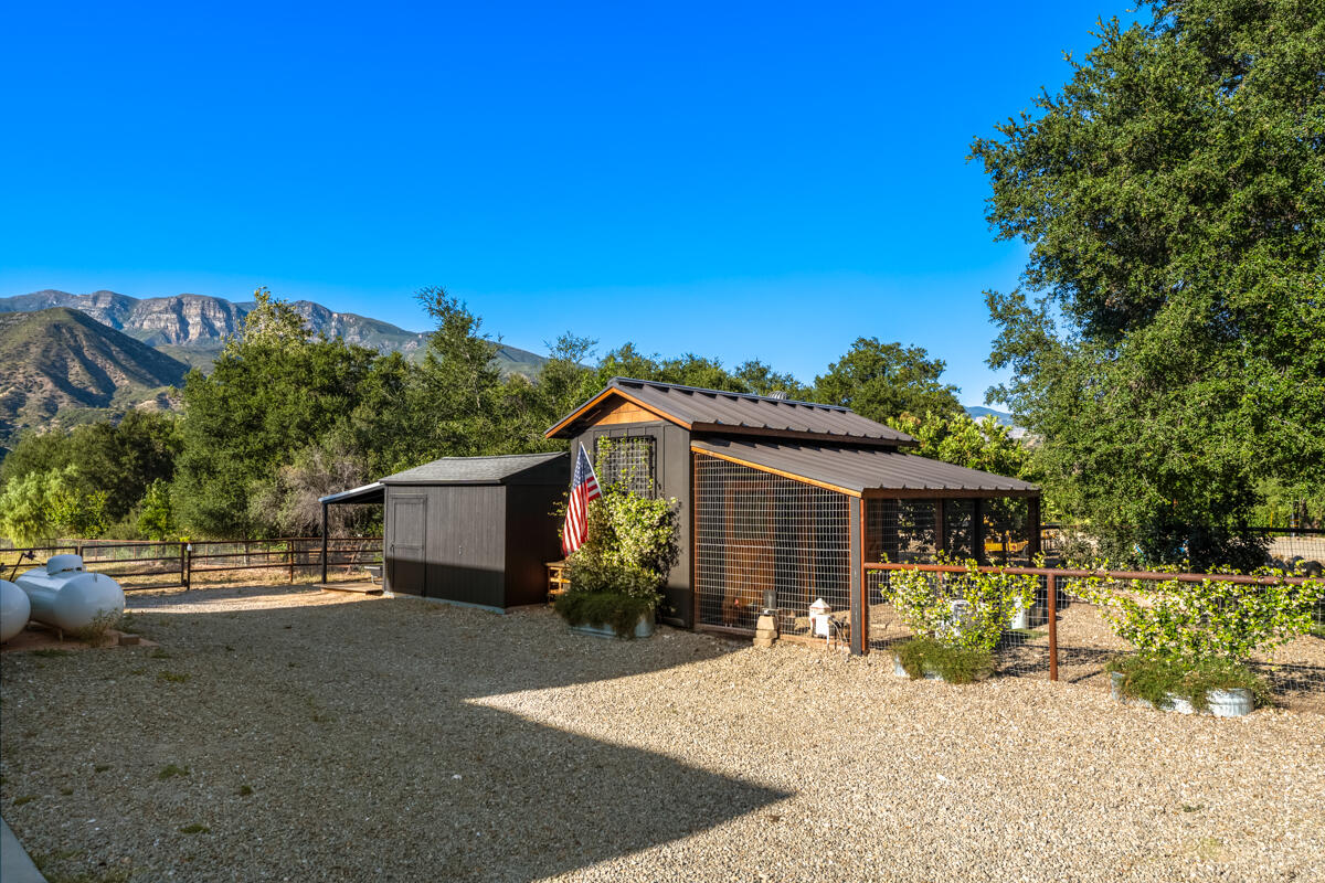 13100 Ojai Road Santa Paula, CA 93060 - Photo 53 of 60 a front view of a house with a yard