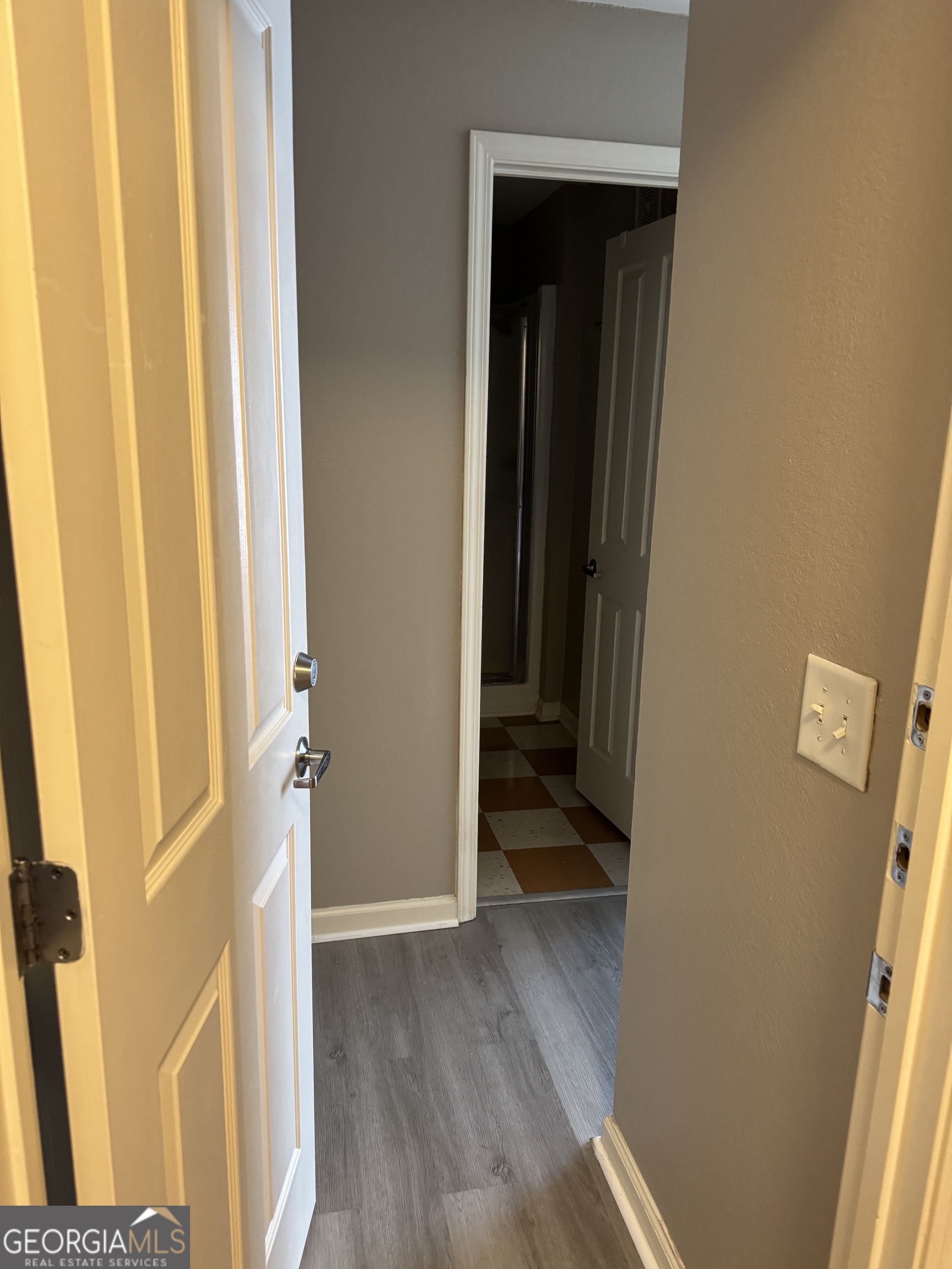 211 North Avenue, Unit 1332 Athens, GA 30601 - Photo 11 of 14 a view of a hallway with wooden floor and closet