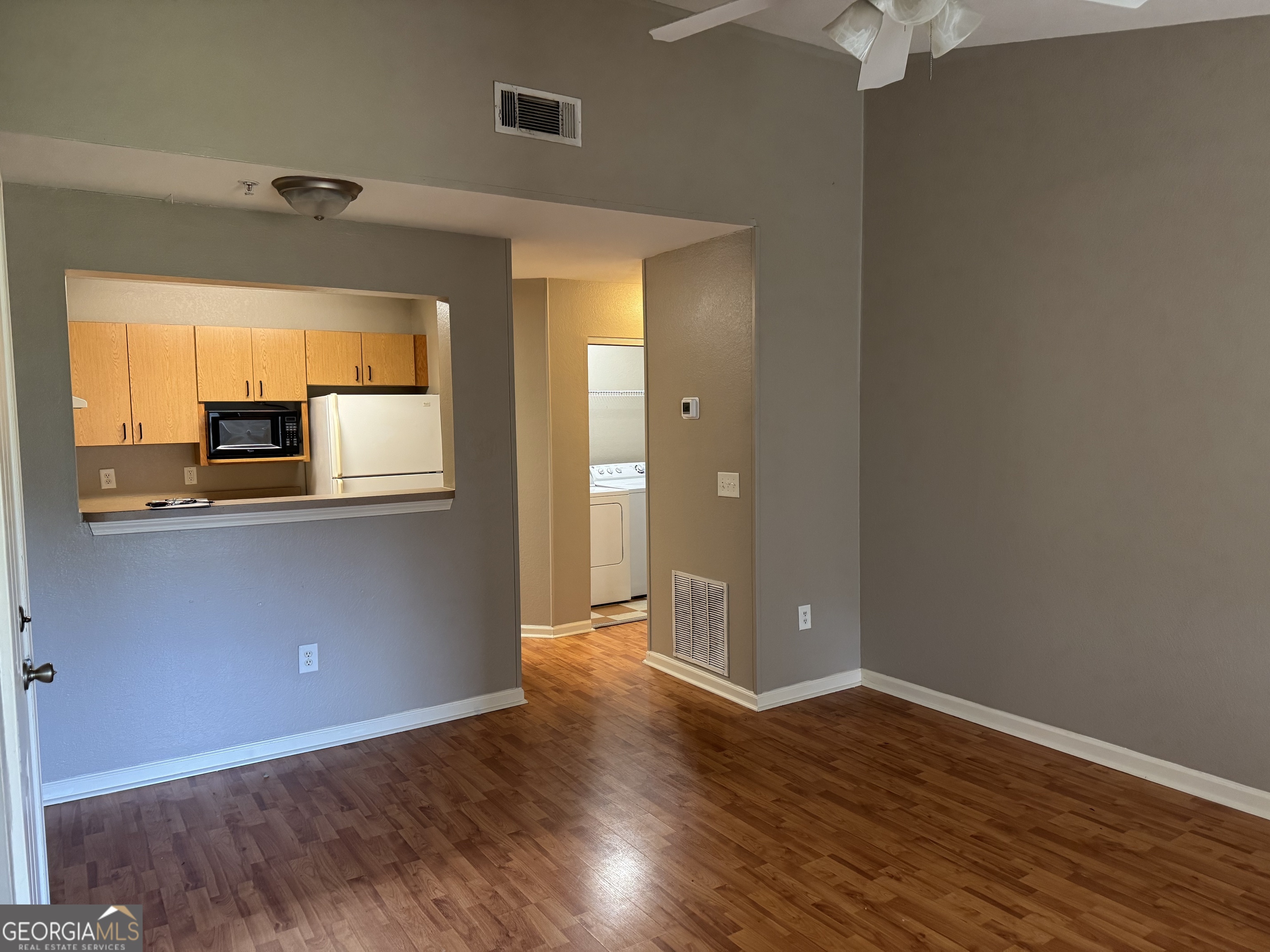 211 North Avenue, Unit 1332 Athens, GA 30601 - Photo 3 of 14 wooden floor and windows in a room