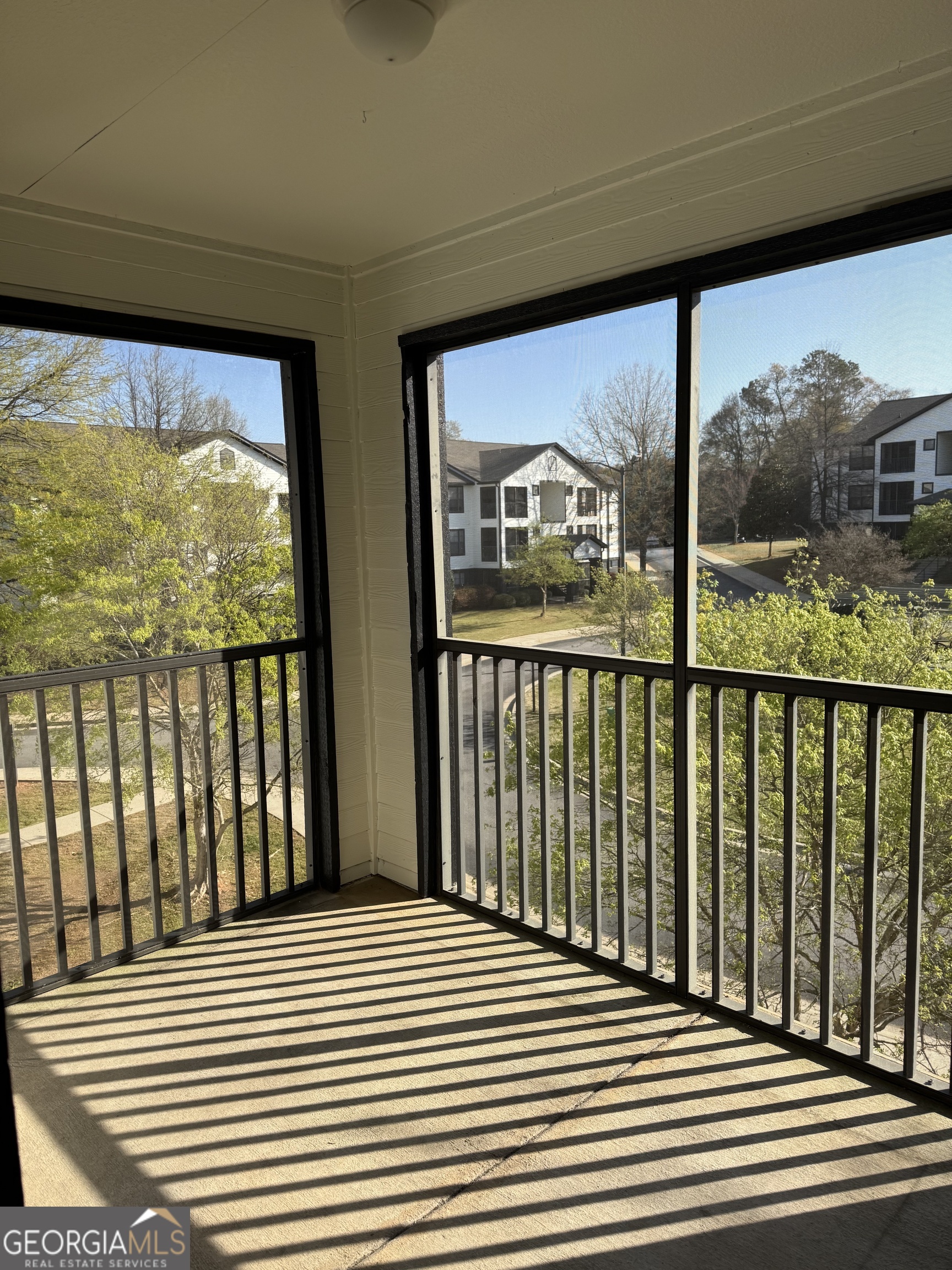 211 North Avenue, Unit 1332 Athens, GA 30601 - Photo 4 of 14 a view of a balcony with wooden floor