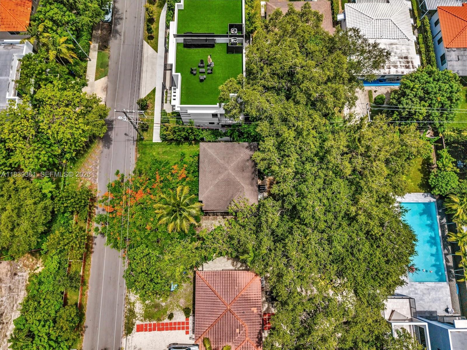 3210 Elizabeth Street Miami, FL 33133 - Photo 37 of 69 an aerial view of a house with a yard and lake view
