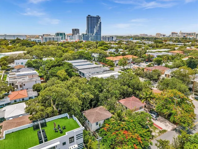 a kitchen with a refrigerator and a stove