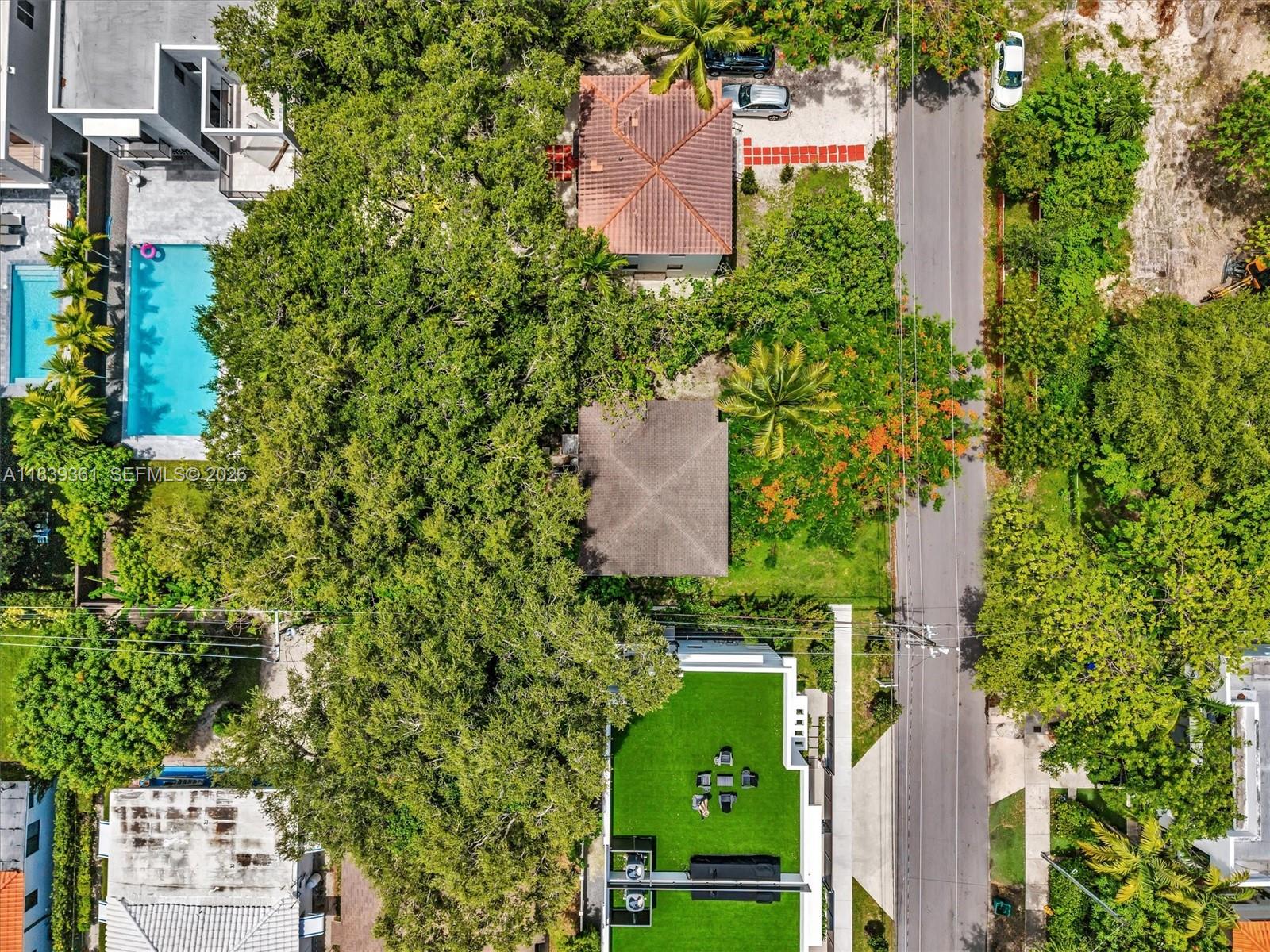 3210 Elizabeth Street Miami, FL 33133 - Photo 40 of 69 an aerial view of a house with a yard and garden in the back