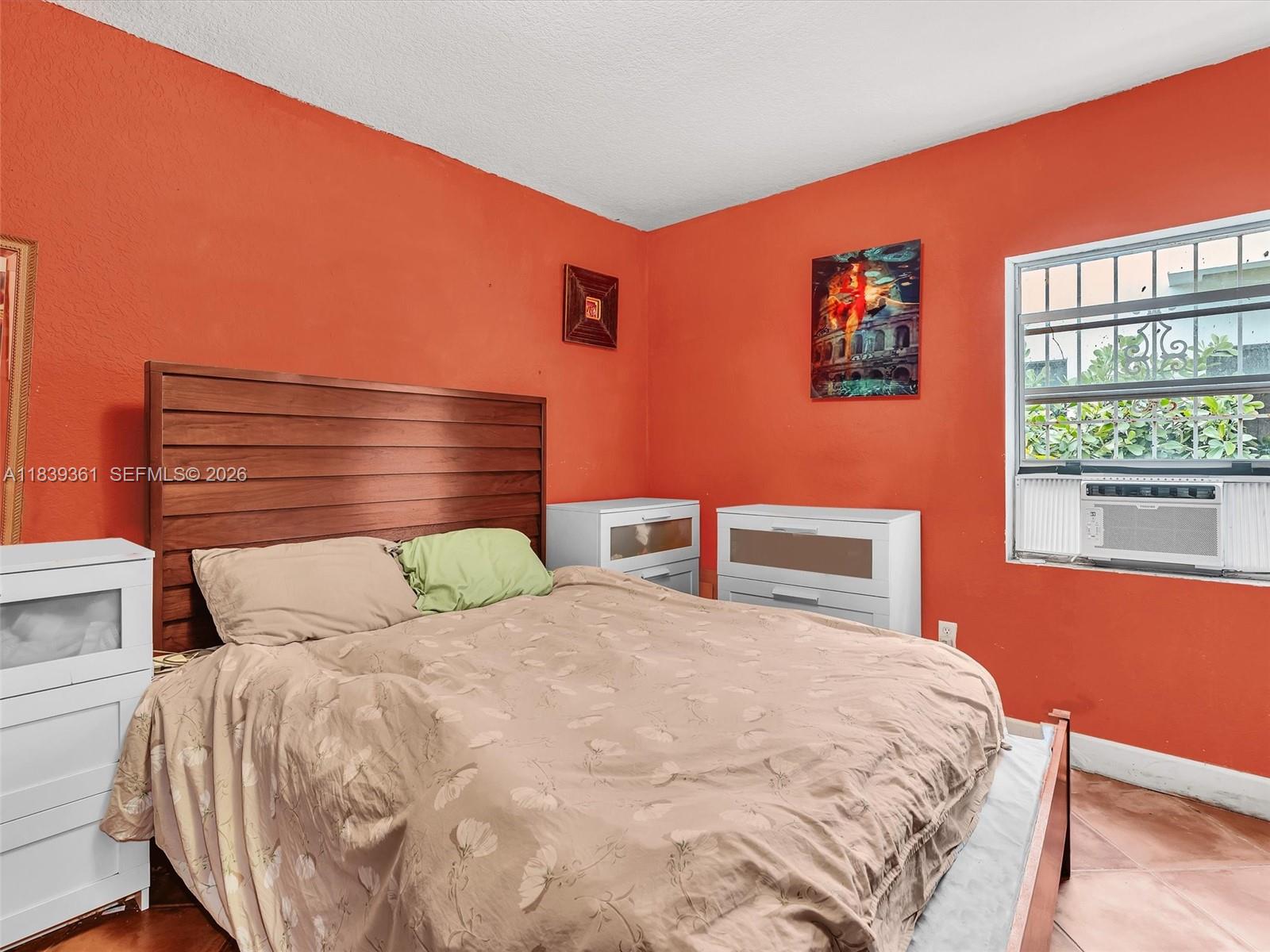 3210 Elizabeth Street Miami, FL 33133 - Photo 42 of 69 a bedroom with a bed and a window