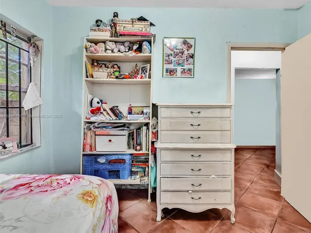 a room with furniture and a flat screen tv