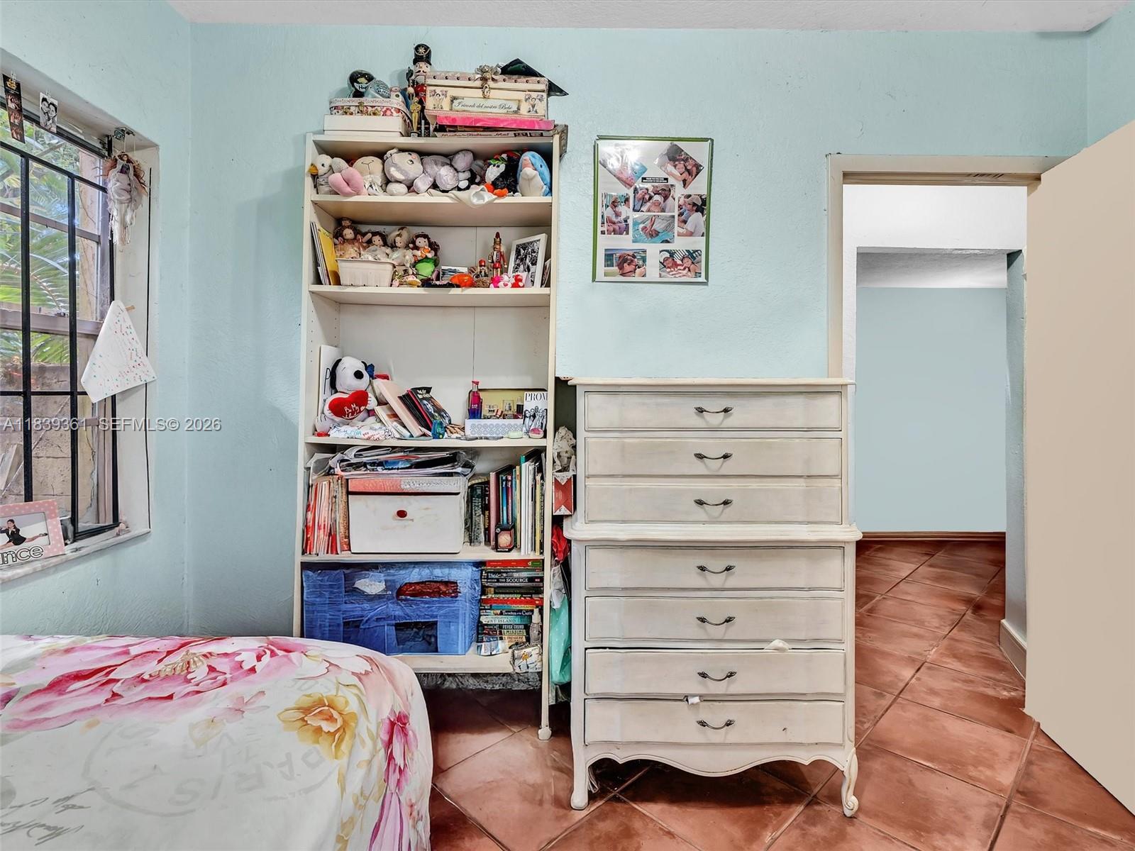 3210 Elizabeth Street Miami, FL 33133 - Photo 45 of 69 a bedroom with a bed and closet