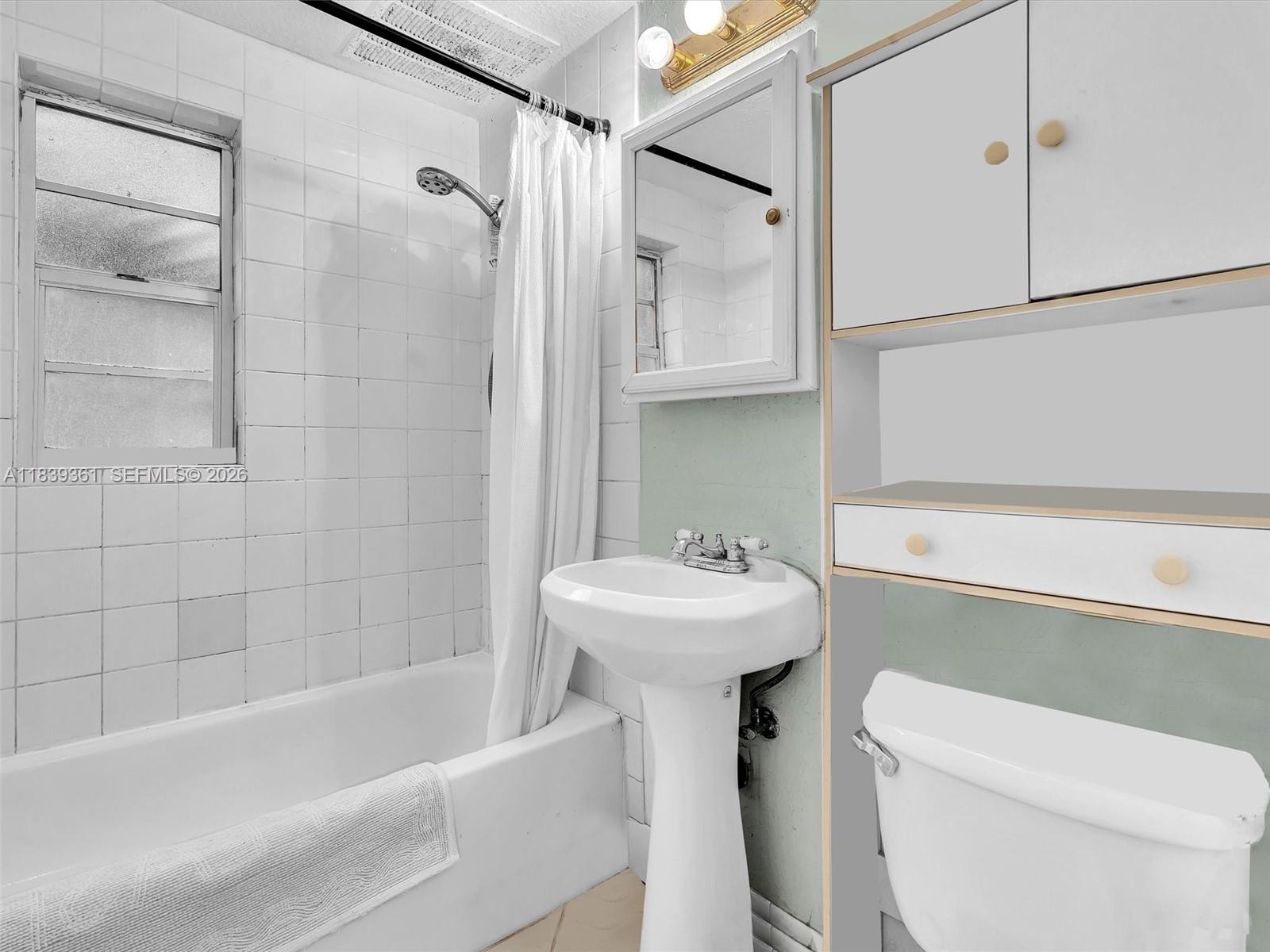 3210 Elizabeth Street Miami, FL 33133 - Photo 47 of 69 a bathroom with a sink a toilet and shower