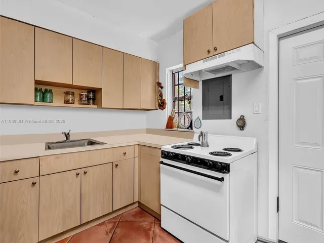 an aerial view of residential building and lake