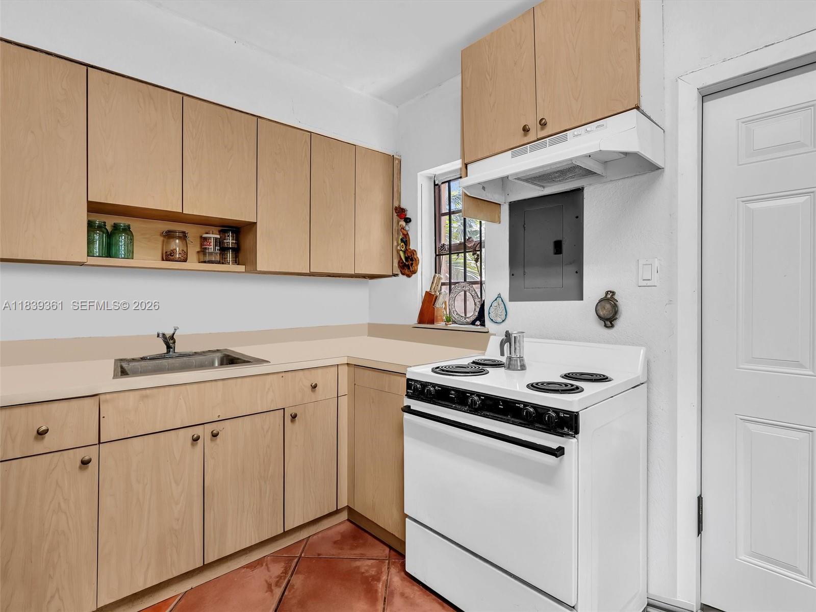 3210 Elizabeth Street Miami, FL 33133 - Photo 51 of 69 a kitchen with cabinets stainless steel appliances and sink