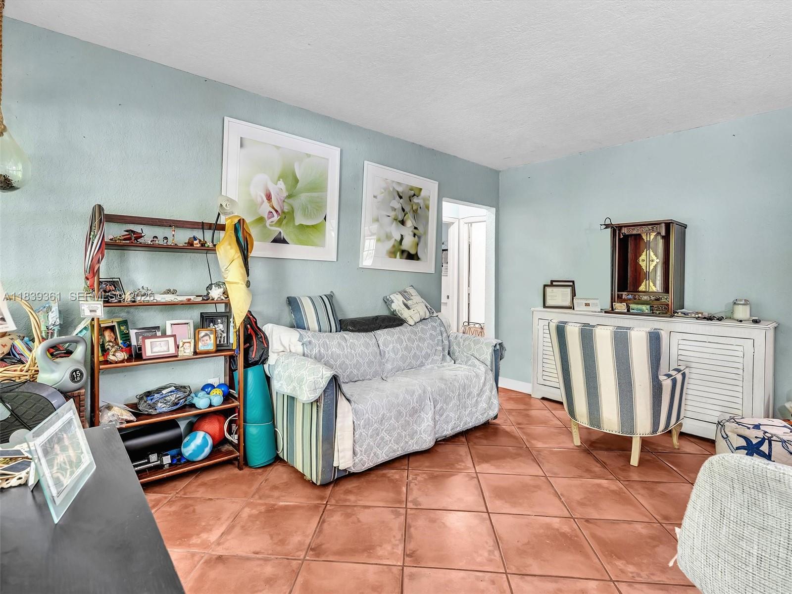 3210 Elizabeth Street Miami, FL 33133 - Photo 58 of 69 a living room with furniture and a flat screen tv