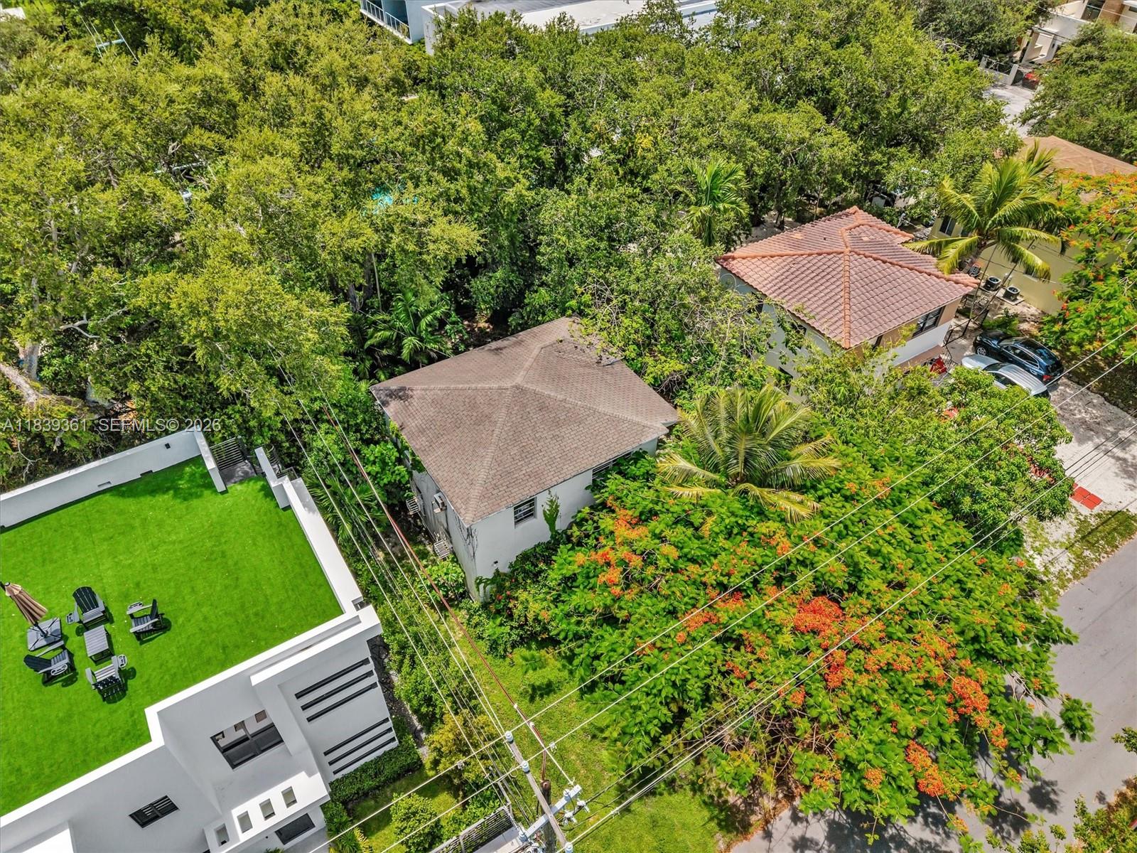 3210 Elizabeth Street Miami, FL 33133 - Photo 65 of 69 an aerial view of a house with a garden
