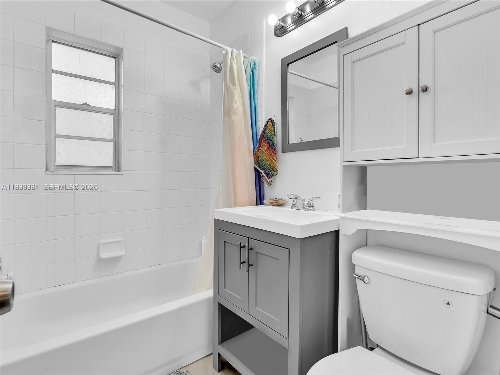 3210 Elizabeth Street Miami, FL 33133 - Photo 7 of 69 a bathroom with a sink toilet vanity and bathtub