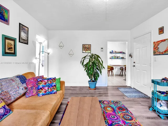 a bedroom with a bed and a white wall
