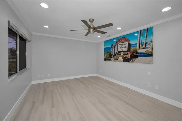 a kitchen with a refrigerator and cabinets