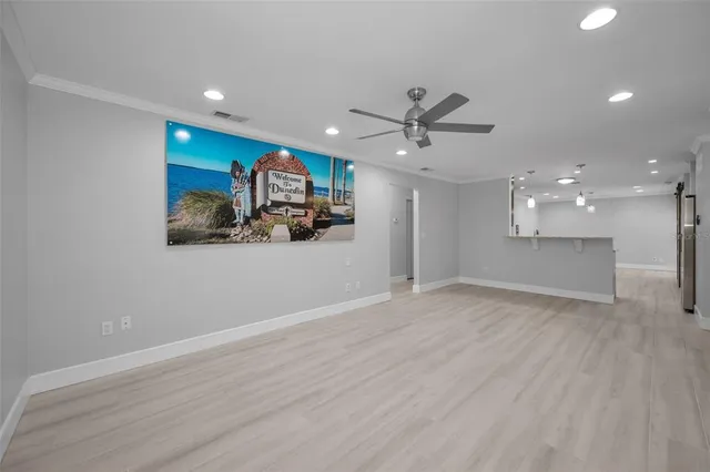 a kitchen with a refrigerator and a sink