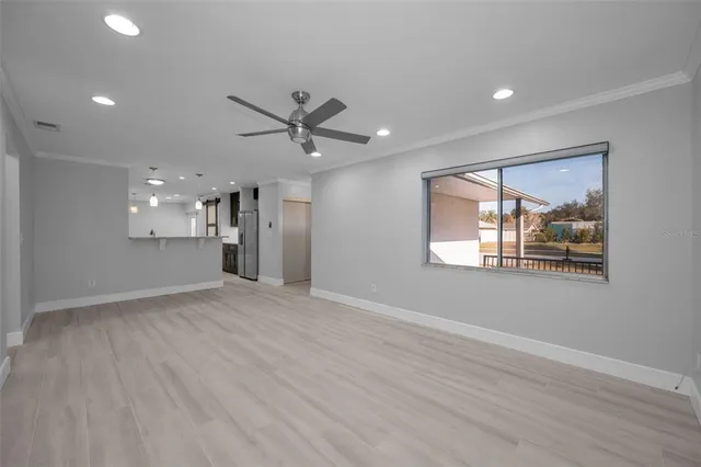 a large kitchen with stainless steel appliances granite countertop a stove and a sink