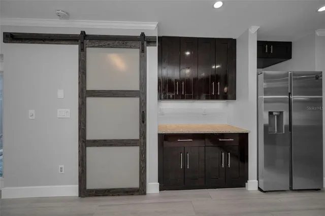 a bathroom with a granite countertop sink a toilet and bathtub