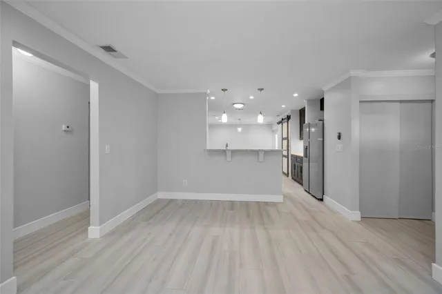 a bathroom with a granite countertop sink a mirror and shower