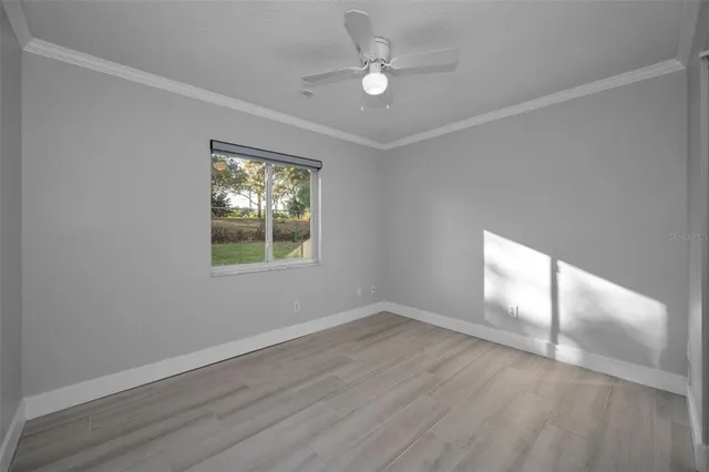 a view of a field with an ocean