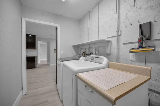 an aerial view of residential house with outdoor space and swimming pool