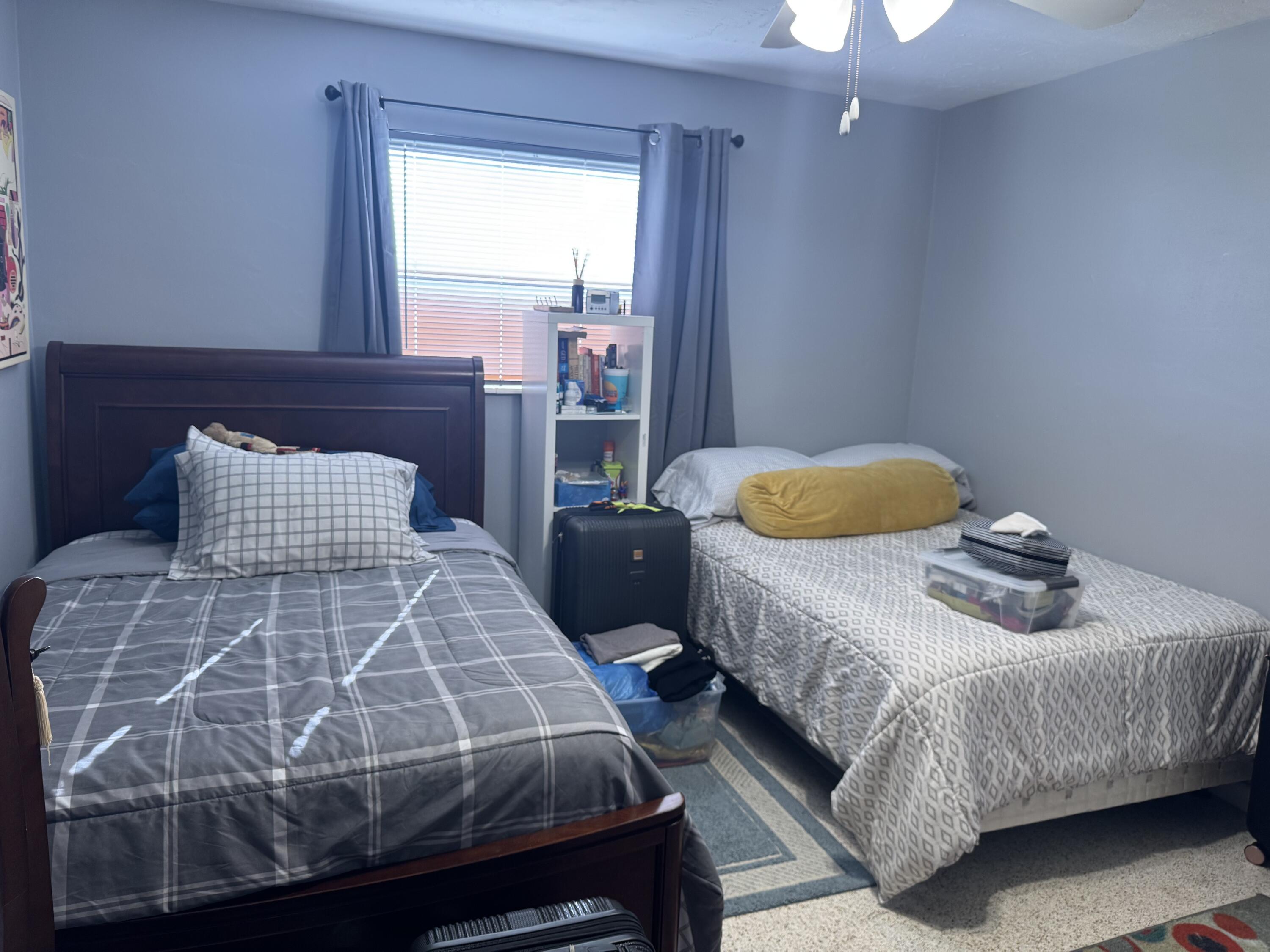 8970 Southwest 53rd Street Cooper City, FL 33328 - Photo 11 of 17 a bedroom with a bed and window