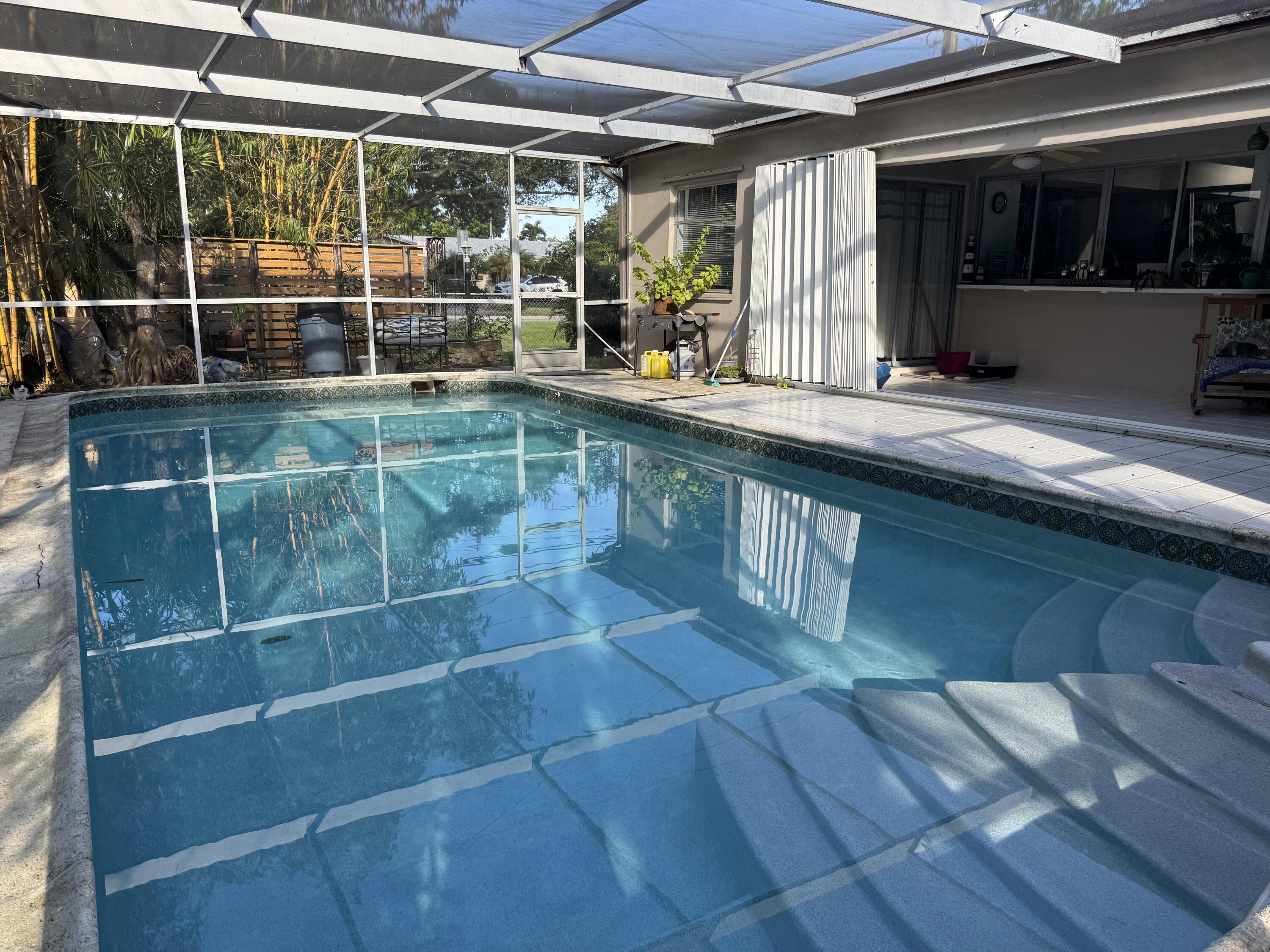 8970 Southwest 53rd Street Cooper City, FL 33328 - Photo 15 of 17 a view of a room with racks on the wall