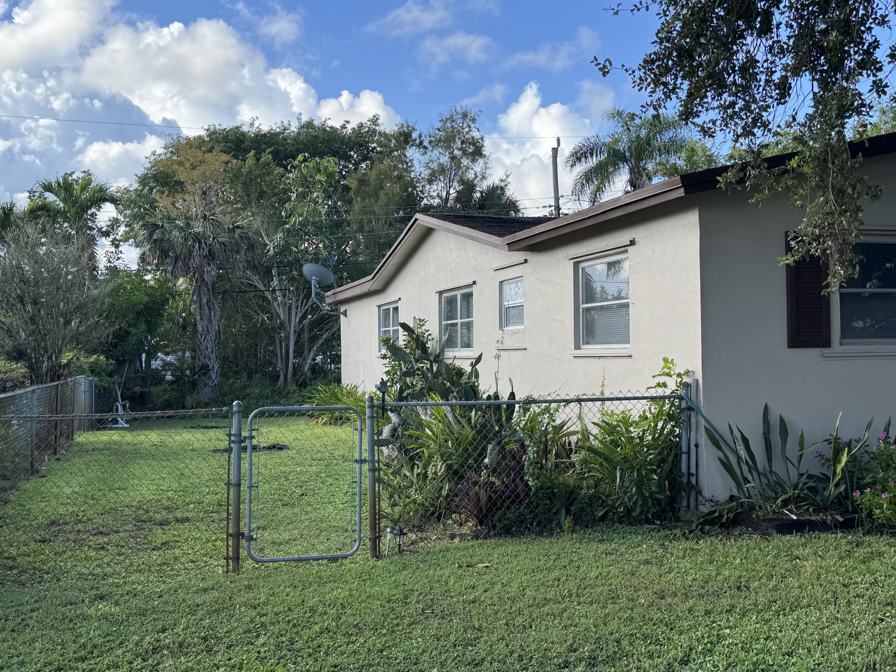 8970 Southwest 53rd Street Cooper City, FL 33328 - Photo 17 of 17 a house that has a tree in front of a white house