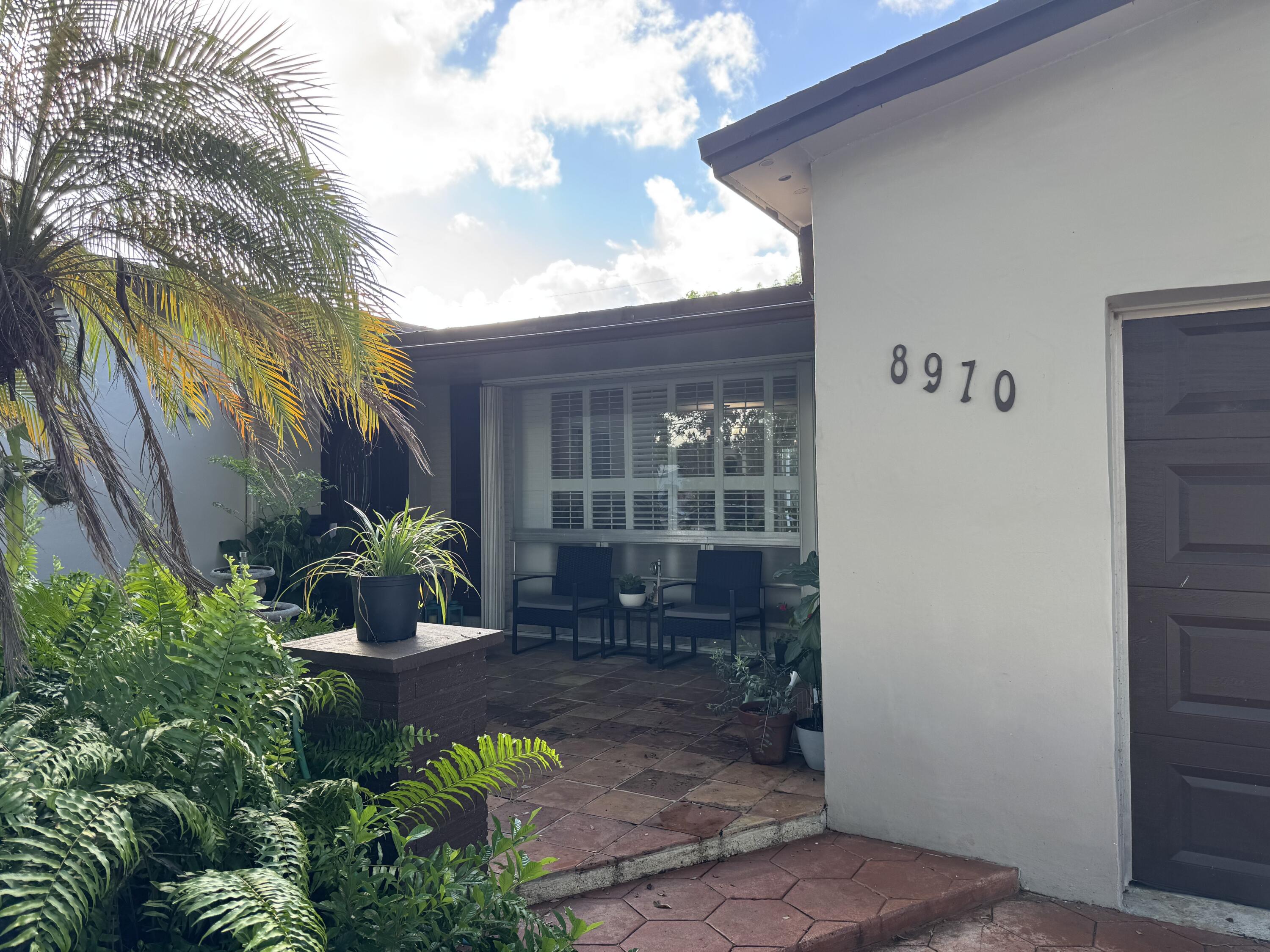 8970 Southwest 53rd Street Cooper City, FL 33328 - Photo 2 of 17 a view of a house with a backyard and sitting area