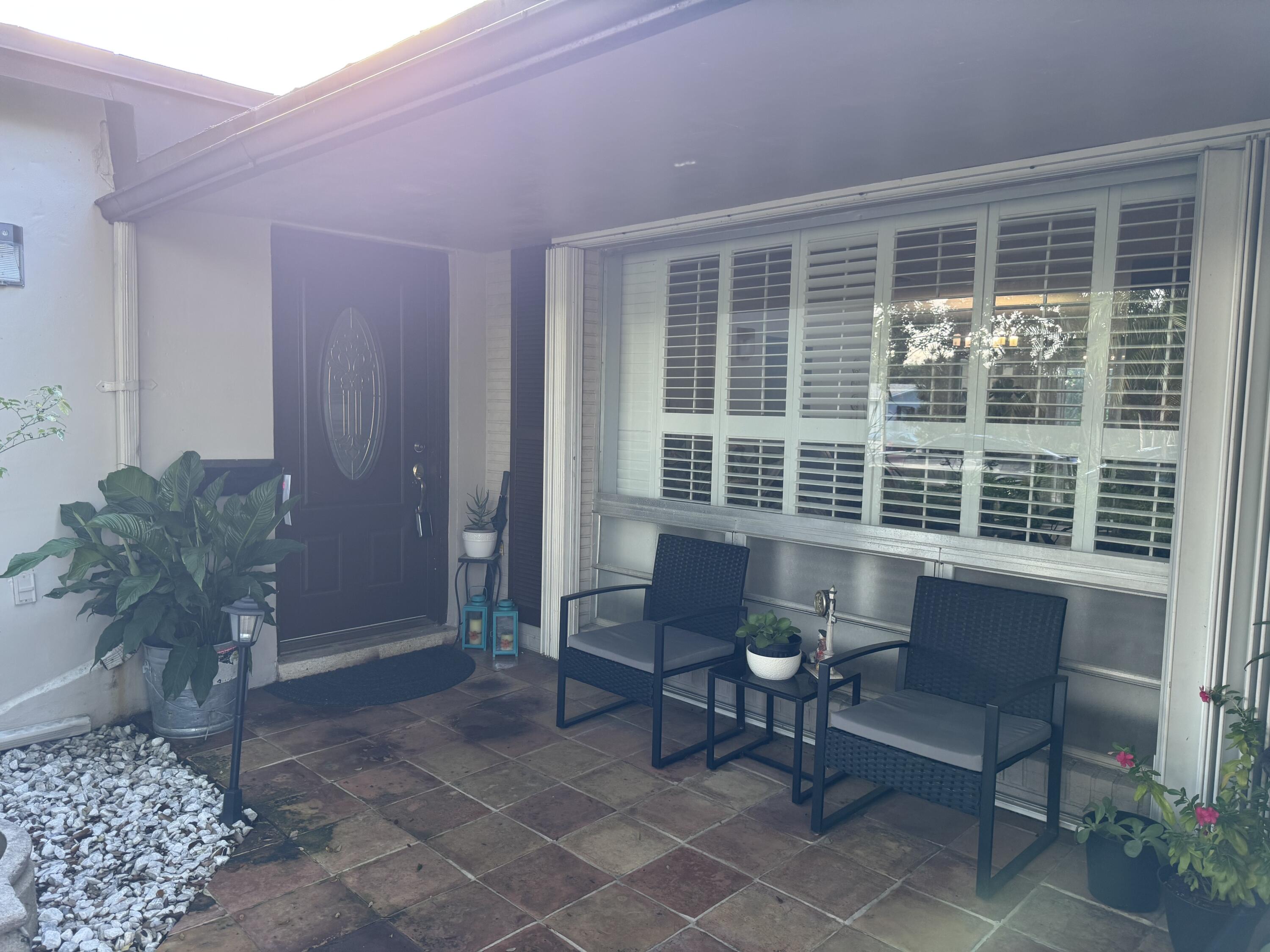 8970 Southwest 53rd Street Cooper City, FL 33328 - Photo 3 of 17 a living room with furniture and a window