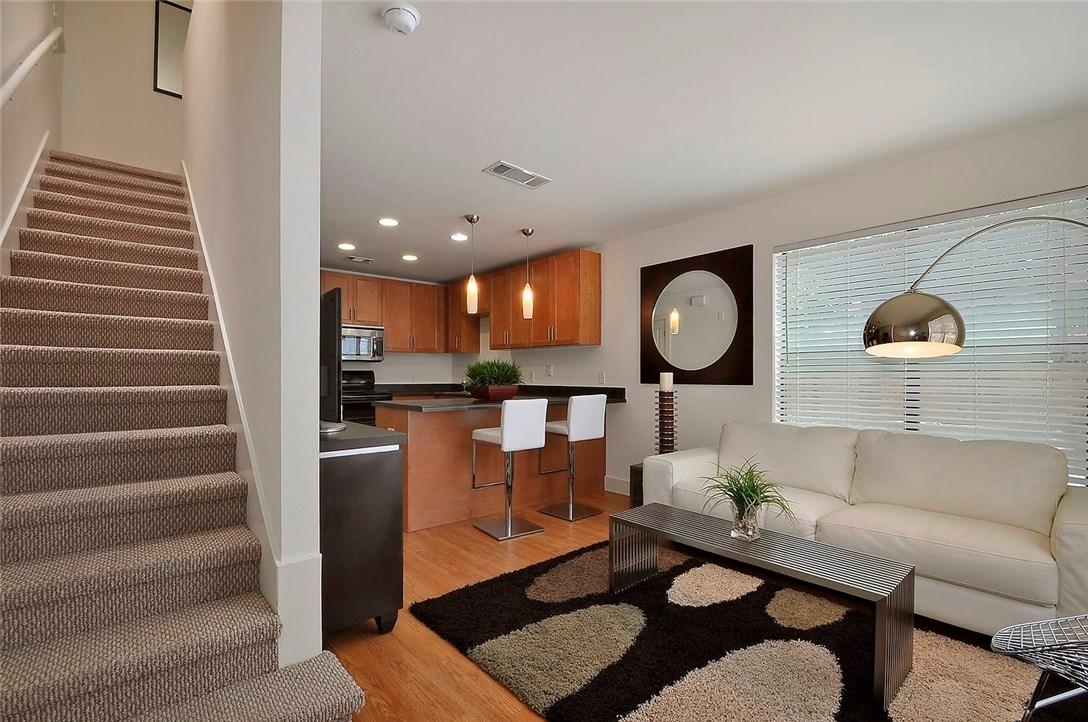 711 West 32nd Street, Unit 101 Austin, TX 78705 - Photo 1 of 1 a living room with furniture and a potted plant