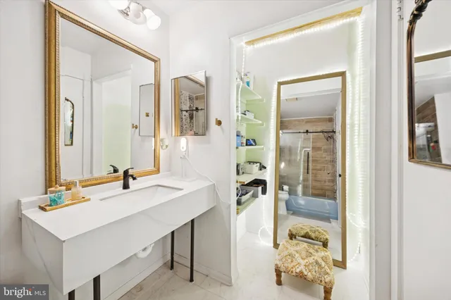 a bathroom with a sink and a mirror