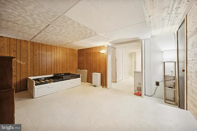 a large white bed in a white room