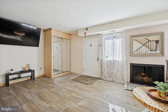 a view of a livingroom with furniture and a fireplace