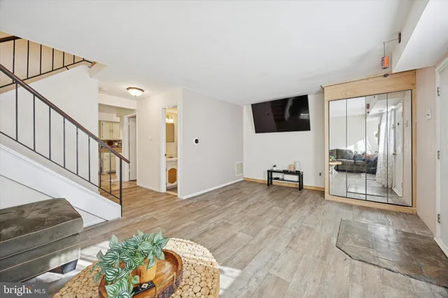 a view of livingroom with furniture and workspace
