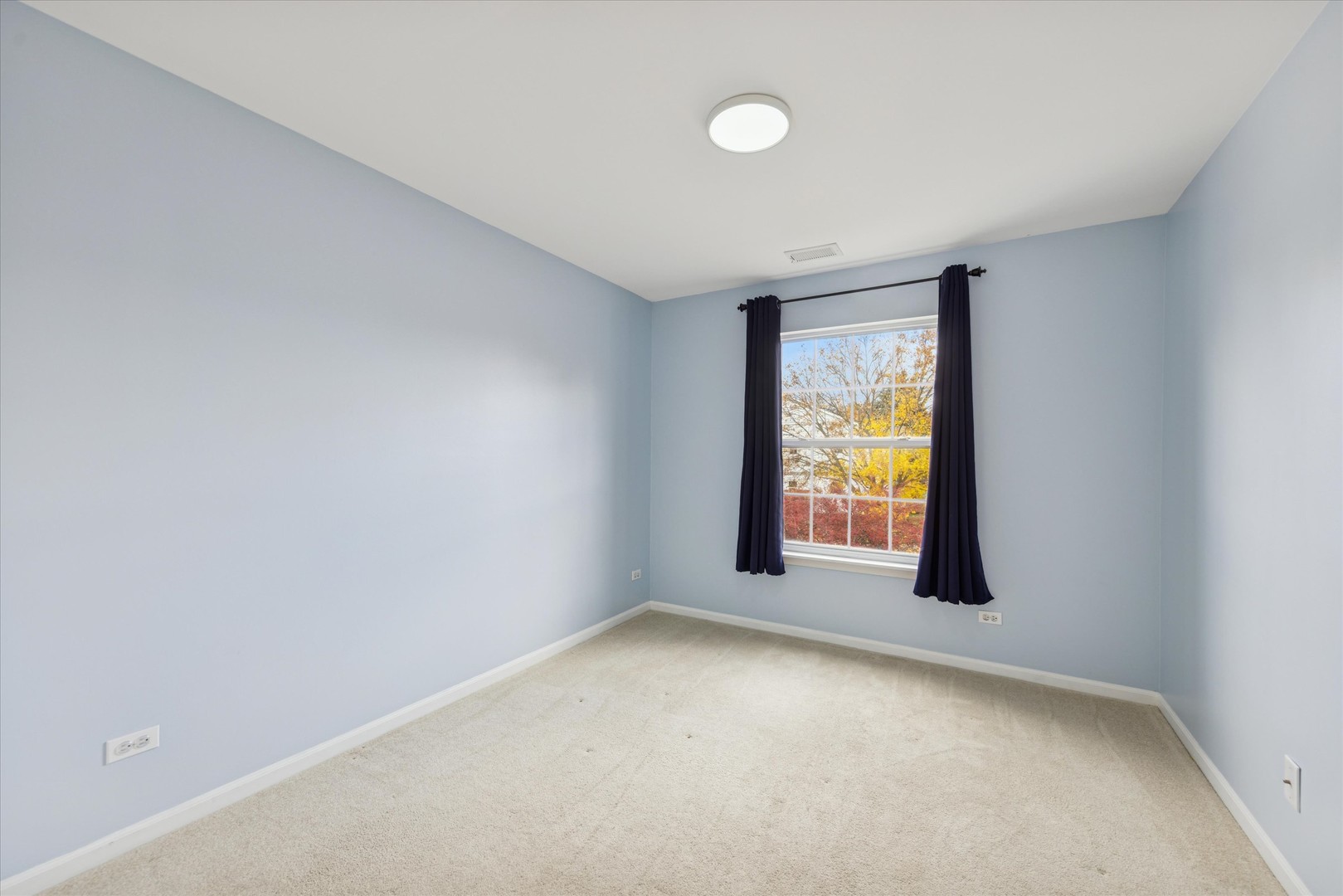 1101 Yorkshire Court, Unit C Elgin, IL 60120 - Photo 14 of 19 an empty room with a window