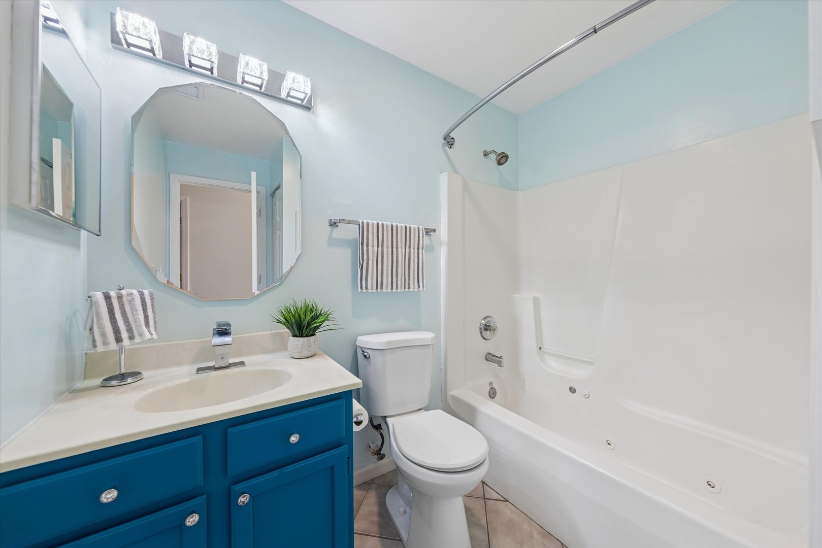 1101 Yorkshire Court, Unit C Elgin, IL 60120 - Photo 16 of 19 a bathroom with a sink a toilet and shower