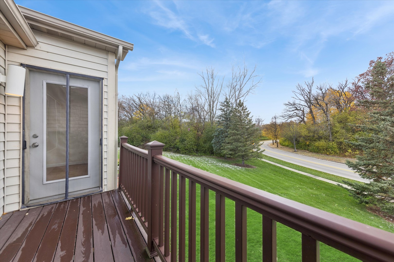1101 Yorkshire Court, Unit C Elgin, IL 60120 - Photo 18 of 19 a view of a balcony with wooden floor