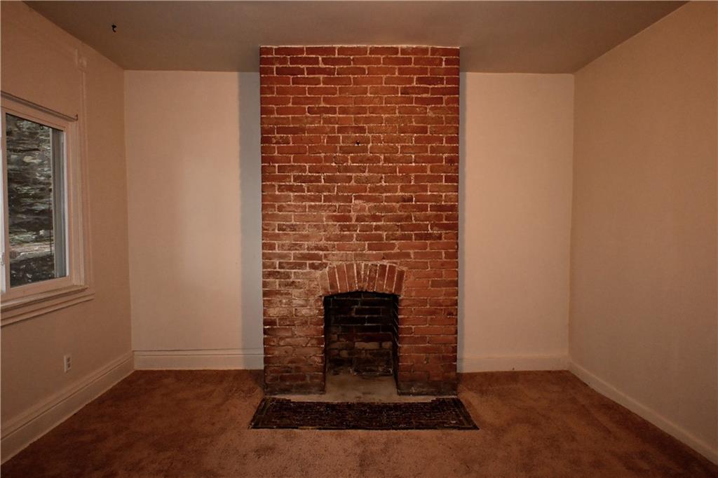 417 Lawn Street Pittsburgh, PA 15213 - Photo 14 of 26 a view of fireplace and wooden floor