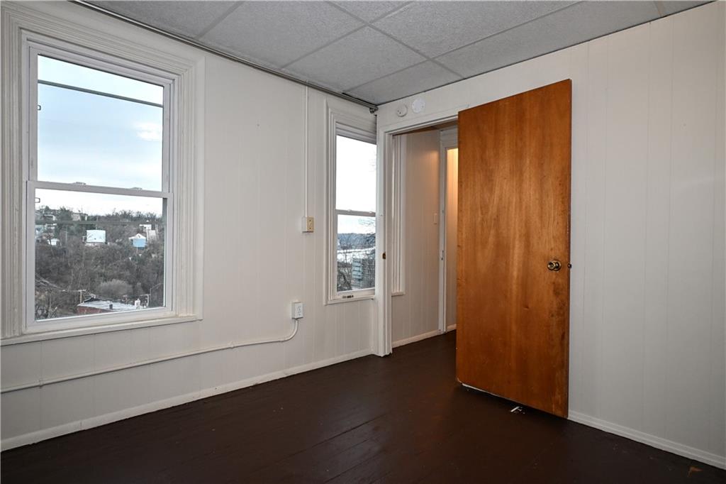 417 Lawn Street Pittsburgh, PA 15213 - Photo 19 of 26 an empty room with wooden floor and windows