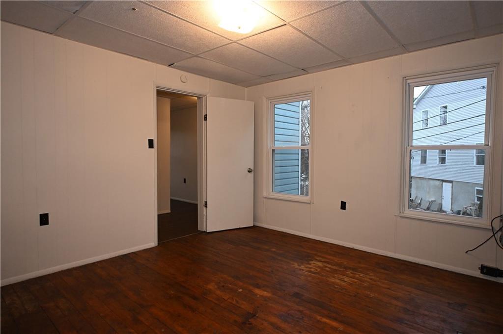 417 Lawn Street Pittsburgh, PA 15213 - Photo 21 of 26 a view of an empty room with wooden floor and a window